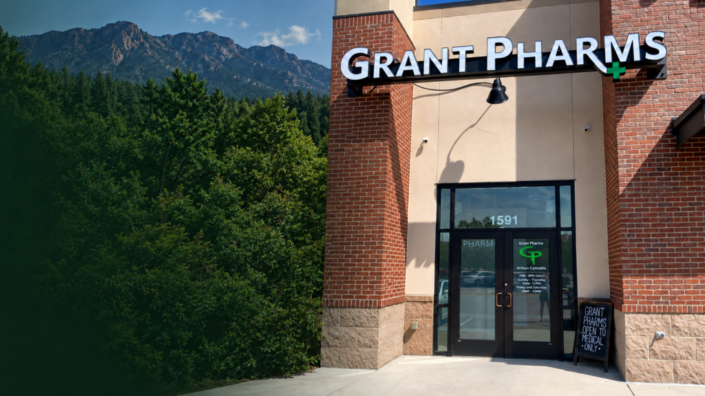 Grant Pharms dispensary storefront in Colorado Springs, Colorado, featuring the company logo and mountain scenery